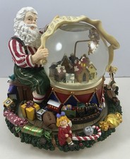 Christmas Snow Globe Here comes Santa Claus Reading Wish List Revolving Wind Up