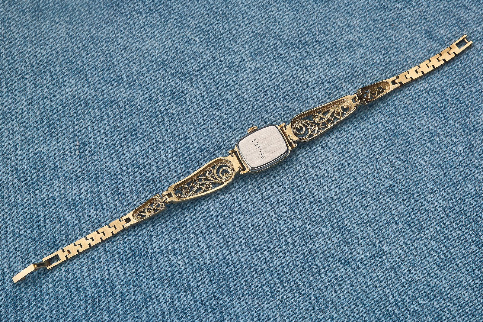 Small women's cocktail watch with gold color. Vintage women's mechanical watch.