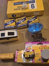 35mm Camera supplies Including GE flash bulbs.35 mm film adapter rings and flas