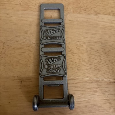 vintage Miller High Life branded bottle opener shaped like a hand truck dolly