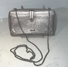 The Sak 3-in-1 Phone Wallet, & Crossbody Silver Metallic With Metal Chain.