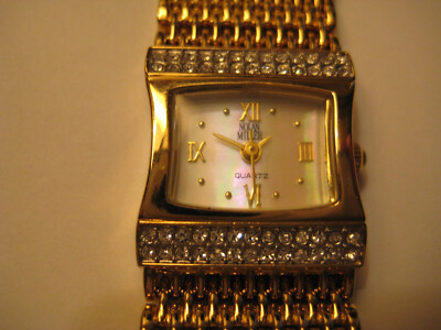 NOLAN MILLER GOLD BRACELET LADIES WATCH W/ NEW BATTERY