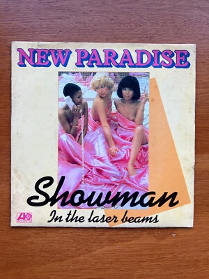 New Paradise - Showman / In The Laser Beams 7in (VG/VG) .*
