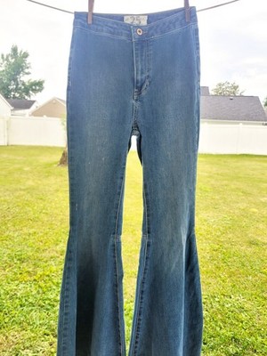 We The Free Women s Size 25 Flare Jeans Blue Denim Raw Hem Distressed Boho