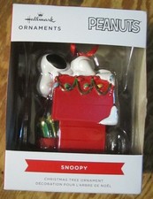 Hallmark Peanuts Snoopy on his decorated doghouse ornament- NIB 