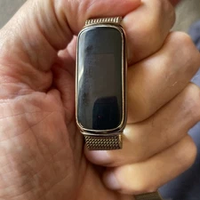 Fitbit Luxe Smart Band Fitness and Wellness Tracker, gold w gold band.
