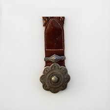 Western-style braided leather belt with a concho Silver buckle. Made In Uruguay
