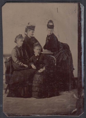 4 women 2 seated, 2 fancy hats pinked cheeks tintype 1860s