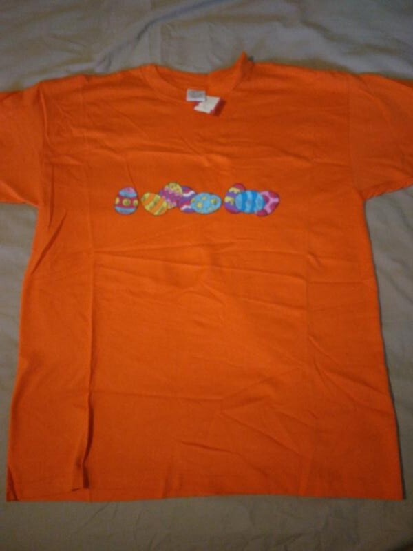 T shirt L adulto arancione con stampa fila di uova di Pasqua 277503