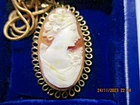 VINTAGE   HAND CARVED OVAL SHAPED CAMEO  PENDANT , BASE METAL ON CHAIN