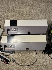 FOR PARTS  2 NES NINTENDO consoles + Cords controllers Games *Powers On* READ
