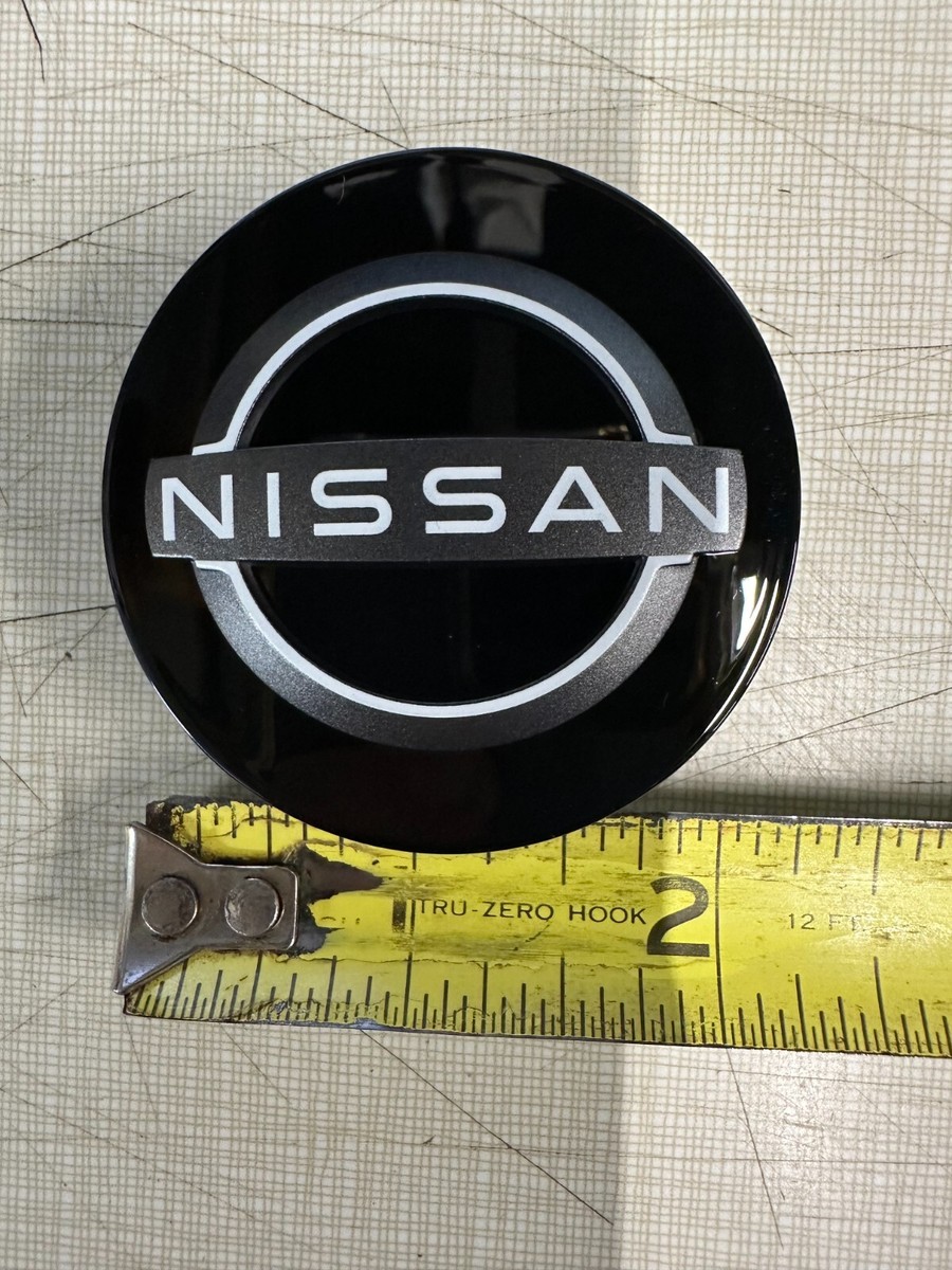 NEW OEM NISSAN CENTER CAP - NEW STYLE / BLACK GLOSS WHITE OUTLINE 