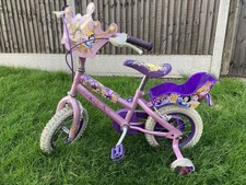 princess bike with doll carrier