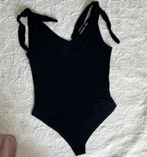 PrettyLittleThing Women s Black Solid One Piece Strap Bodysuit Size 6