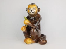 Vintage  Friendly Smiling Ceramic Monkey eating a Banana