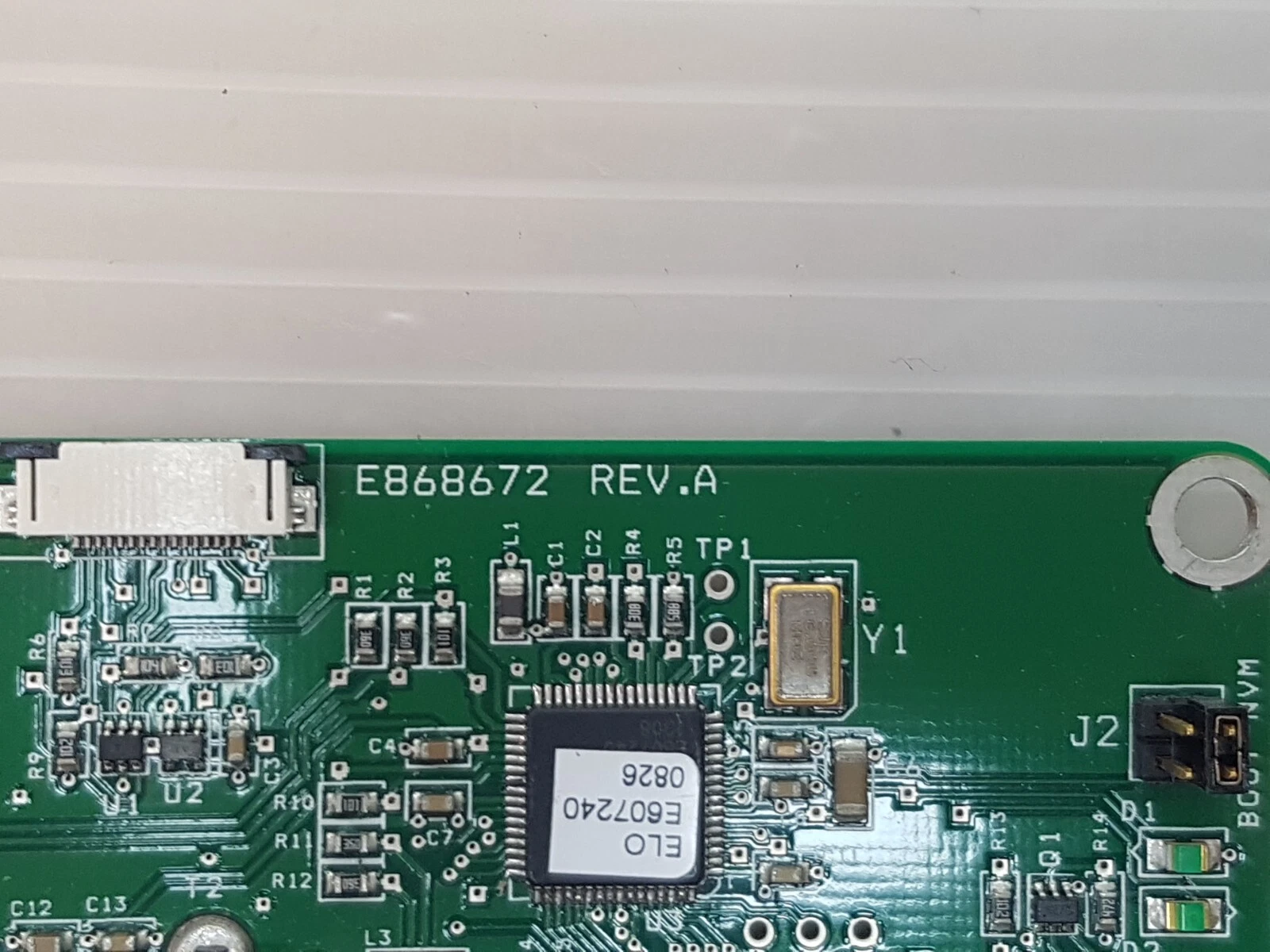 Close-up of the Elo 2701 board: E868672 Rev A marking and ELO E607240 controller chip