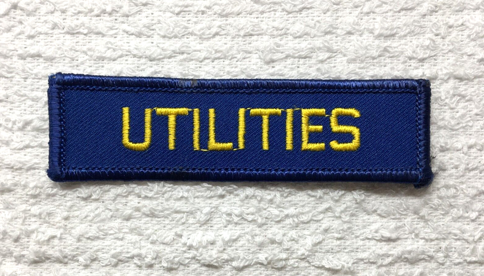 PATCH Utilities Gold on Blue Background