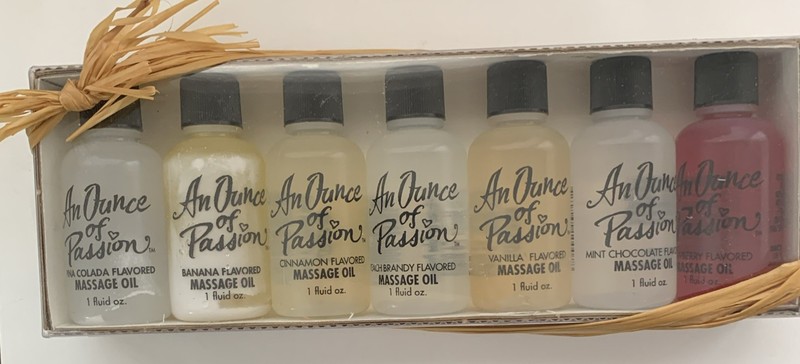 An Ounce Of Passion Massage Oil Set of 7 1oz Bottles. All Different Flavors.