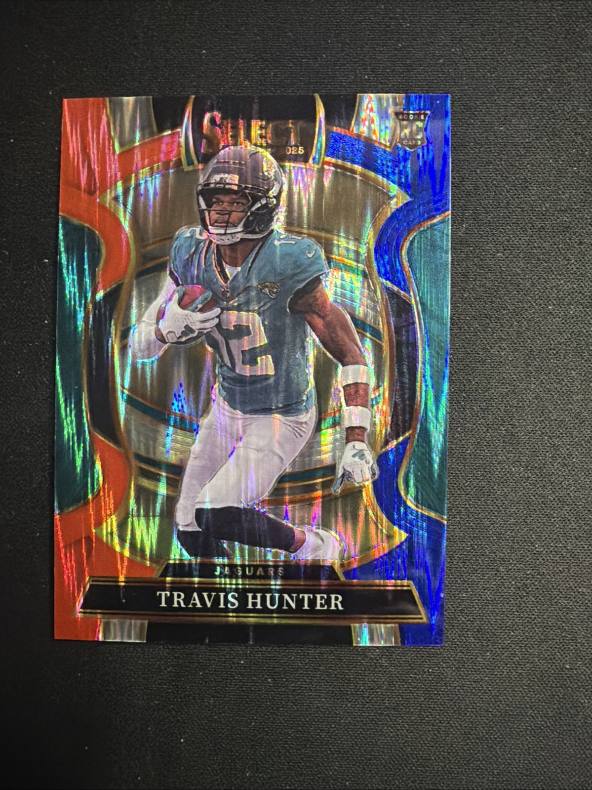 2025 Panini Select #28 Travis Hunter Concourse Red & Blue Prizm Shock RC Jaguars