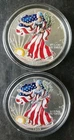 Two 1999 $1 American Silver Eagle Dollars Colorized in Capsules