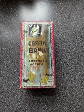 Vintage Yone Tin Plate Coffin Coin Bank Clockwork