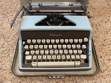 Olympia Deluxe SM7 Portable Typewriter W/Case Blue Very Good Condition thumbnail