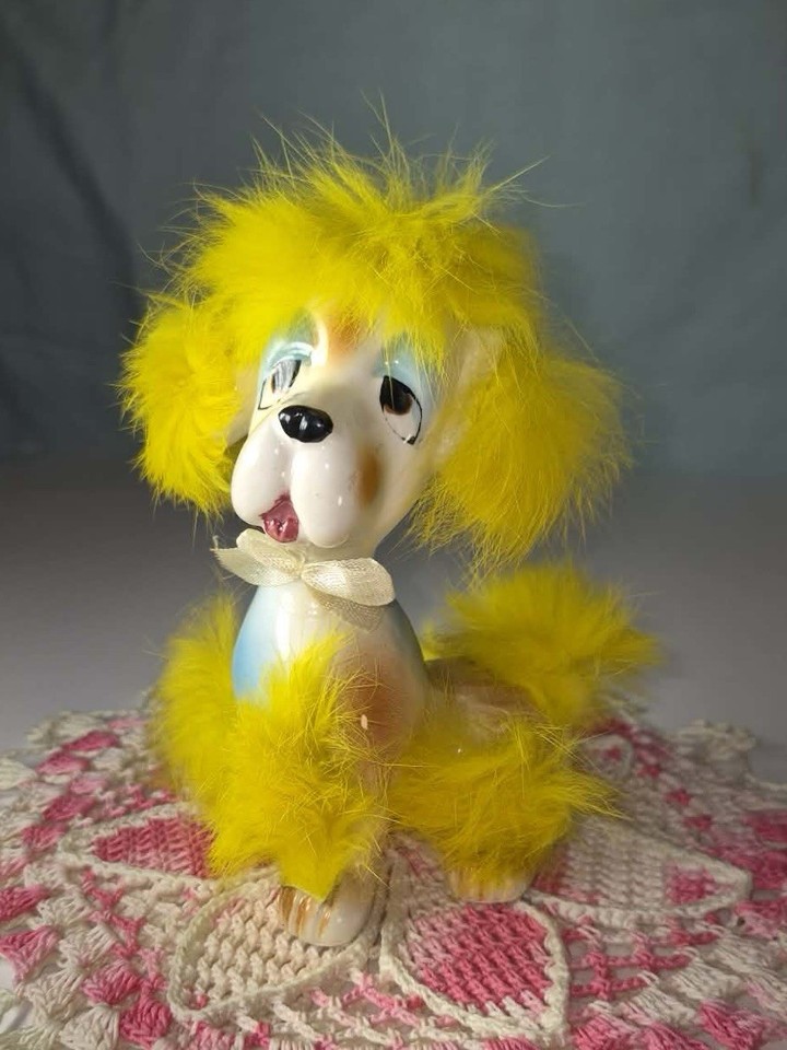 A rare MCM Japan-made dog figurine with actual yellow fur — the kind of mid-century oddball collectible that serious kitsch hunters dream of finding.
