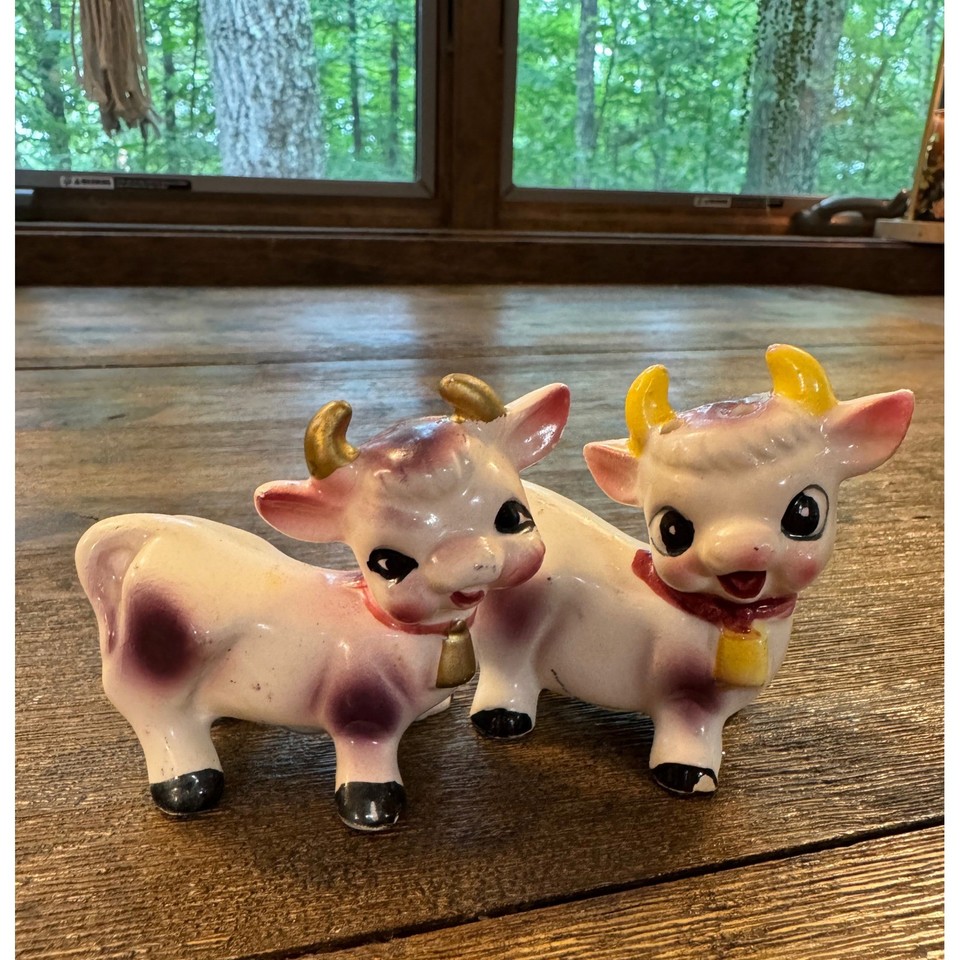 Elsie the Borden Cow reimagined in purple-spotted ceramic — an anthropomorphic brand mascot collectible with serious vintage charm.