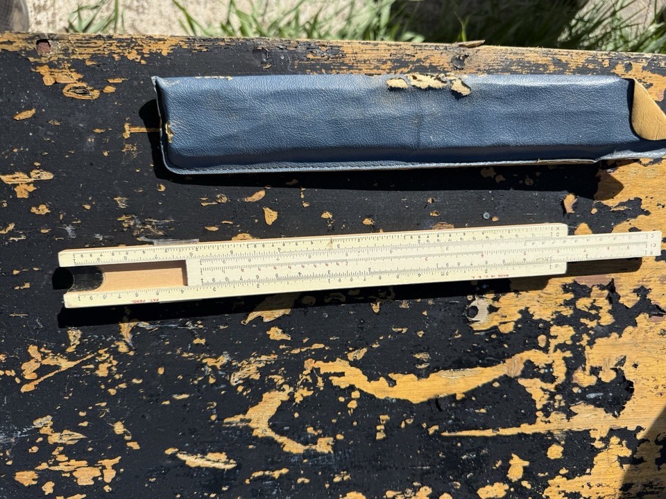 A proper wooden-bodied American-made slide rule with its original blue case — tactile, handsome, and genuinely Made in the USA.