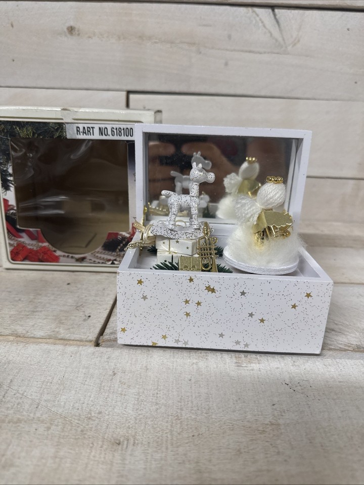 A German Christmas angel music box (Weihnachts Musikdose) that still has its original box — the kind of heirloom holiday piece you stumble on once.