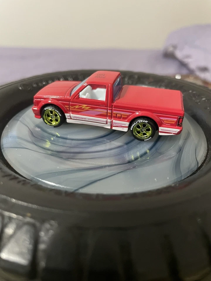HOT WHEELS 91 GMC SYCLONE VERMELHO/BRANCO INT PROTÓTIPO TESTE DE FÁBRICA PILOTOS REAIS - Imagem 2 de 4