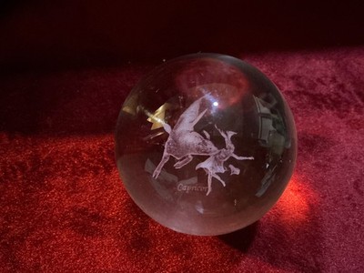 Crystal Ball with Zodiac sign Capricorn engraved inside. Silver Stand  included