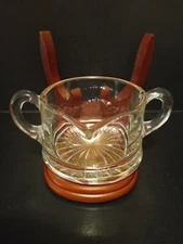 ANTIQUE 1 CUP, (8 OZ.) CLEAR GLASS, DOUBLE HANDLED CREAMER. BUBBLES IN GLASS