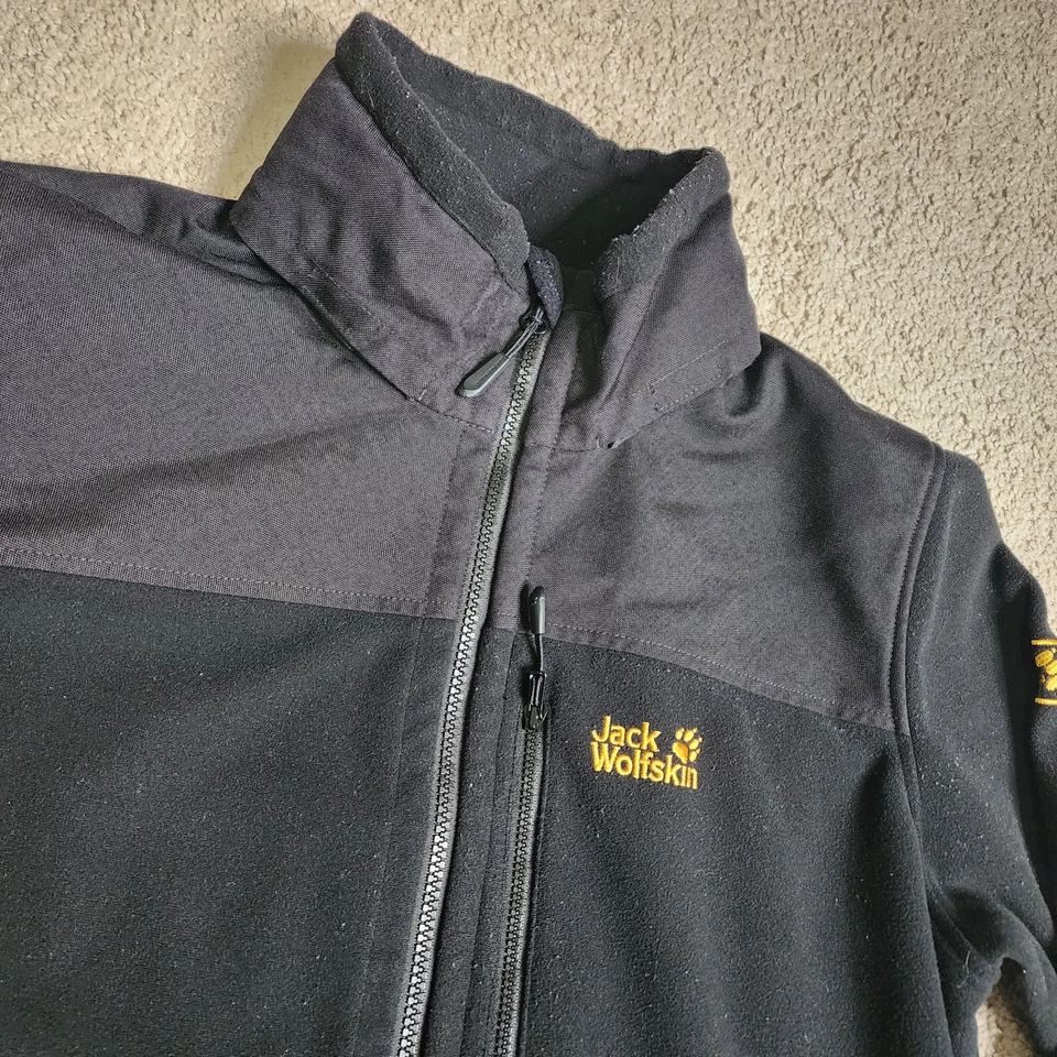 Chaqueta cortavientos negra mediana Jack Wolfskin para hombre con cremallera completa Cordura StormLock Foto 3 de 4