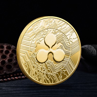 Golden Ripple XRP cryptocurrency physical concept coin isolated on