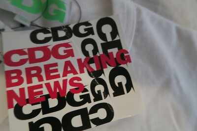 CDG Breaking News Celebration Better Avi Gold Collab Tee DSM 