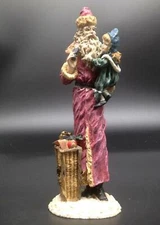 Resin Primitive Vintage Style German Pencil Santa Holding Child Figurine