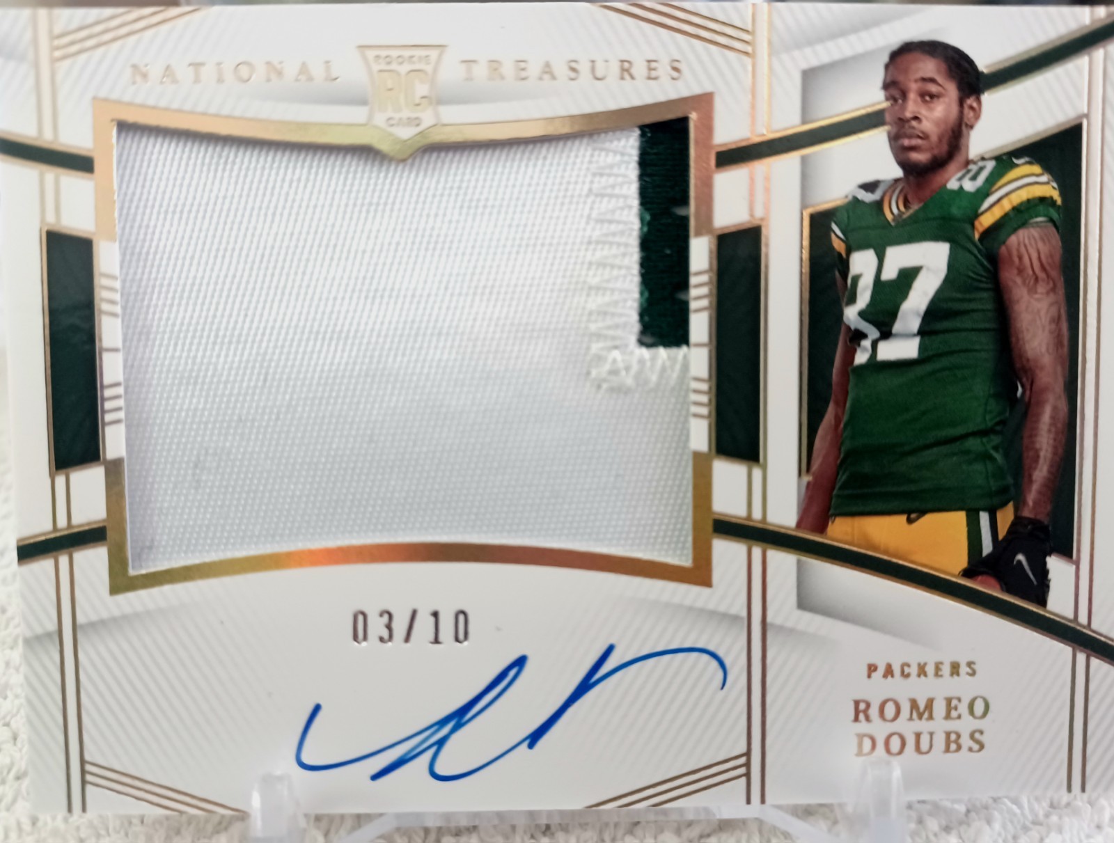 Romeo Doubs Panini National Treasures Tremendous Treasures Rookies Material #RDO Holo Gold