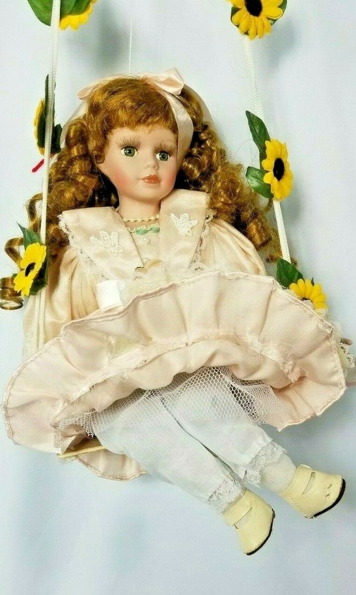 KINNEX INT'L PORCELAIN DOLL on SWING 