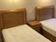 Wooden Sleigh beds, two single