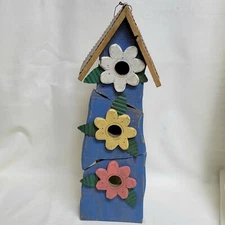 Rustic handpainted birdhouse with wooden flowers and metal roof primitive style