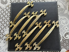 Seven vintage style brass handles for doors