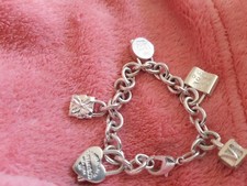 tiffanny n co bracelet with charms . Used good condition.  Hardly worn