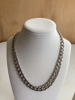 This is a Silver tone curbed chain necklace
