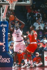 Chris Webber Washington Bullets looks to shoot over Hakeem Olajuwo- Old Photo