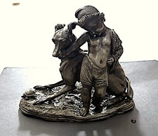 Vintage cold-cast metal or bronze sculpture with boy beside a greyhound