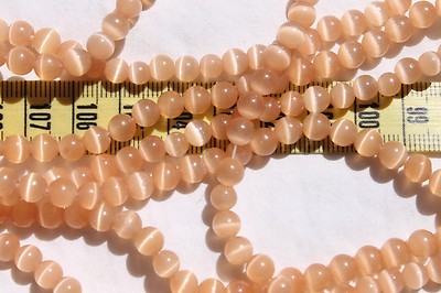 6mm Cat's Eye Fiber Optic Beads 14'' Strand/ Pale Orange/avg. 65pcs