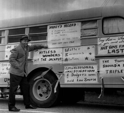 Walter ''Smokey'' Alston has a laugh as he reads signs referencing h- Old Photo