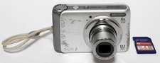 Canon PowerShot A3100 IS 12.1MP Digital Camera Silver Tested W/Battery, SD Card