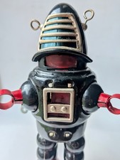 Retro wind-up walking black robot